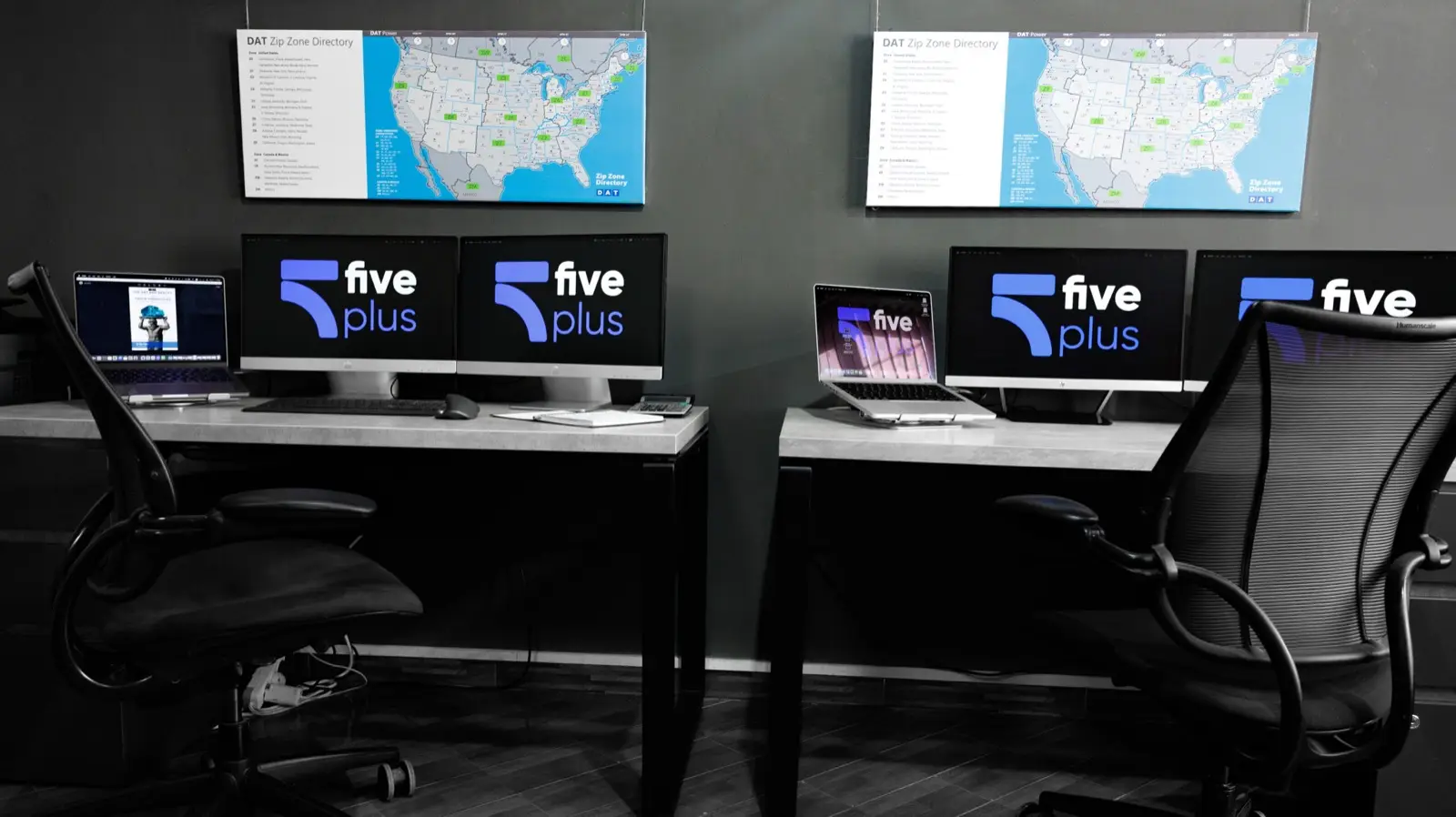 FivePlus dispatch floor with branded workstations and live U.S. freight maps