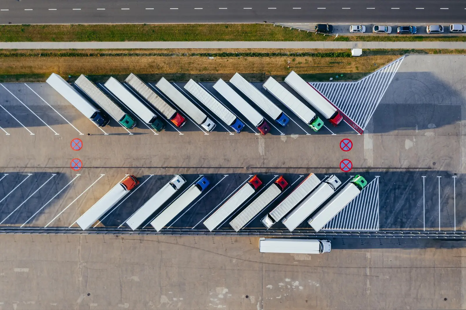 Aerial view of trucks and trailers parked at a freight terminal