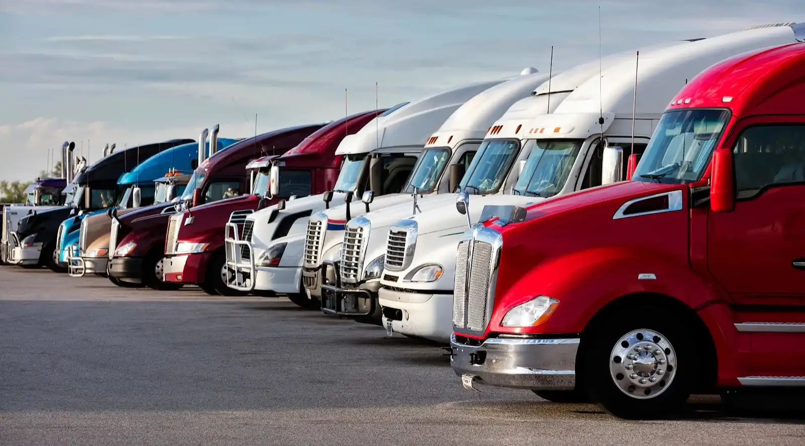Row of semi trucks from growth-focused U.S. carrier fleets